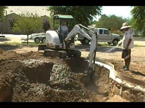 mini bobcat swimming pool excavation|inground pool for bobcats.